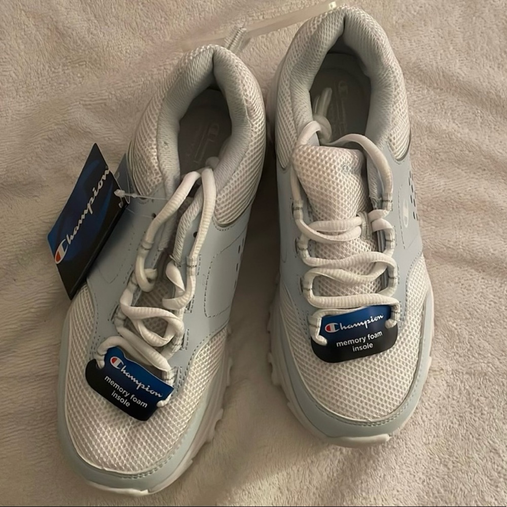 white and light blue champion memory foam insole shoes